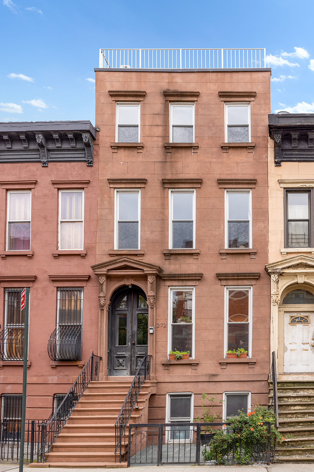 272 Putnam Avenue, Unit B Brooklyn, NY 11216 - Photo 12 of 13 a large building with a lot of windows