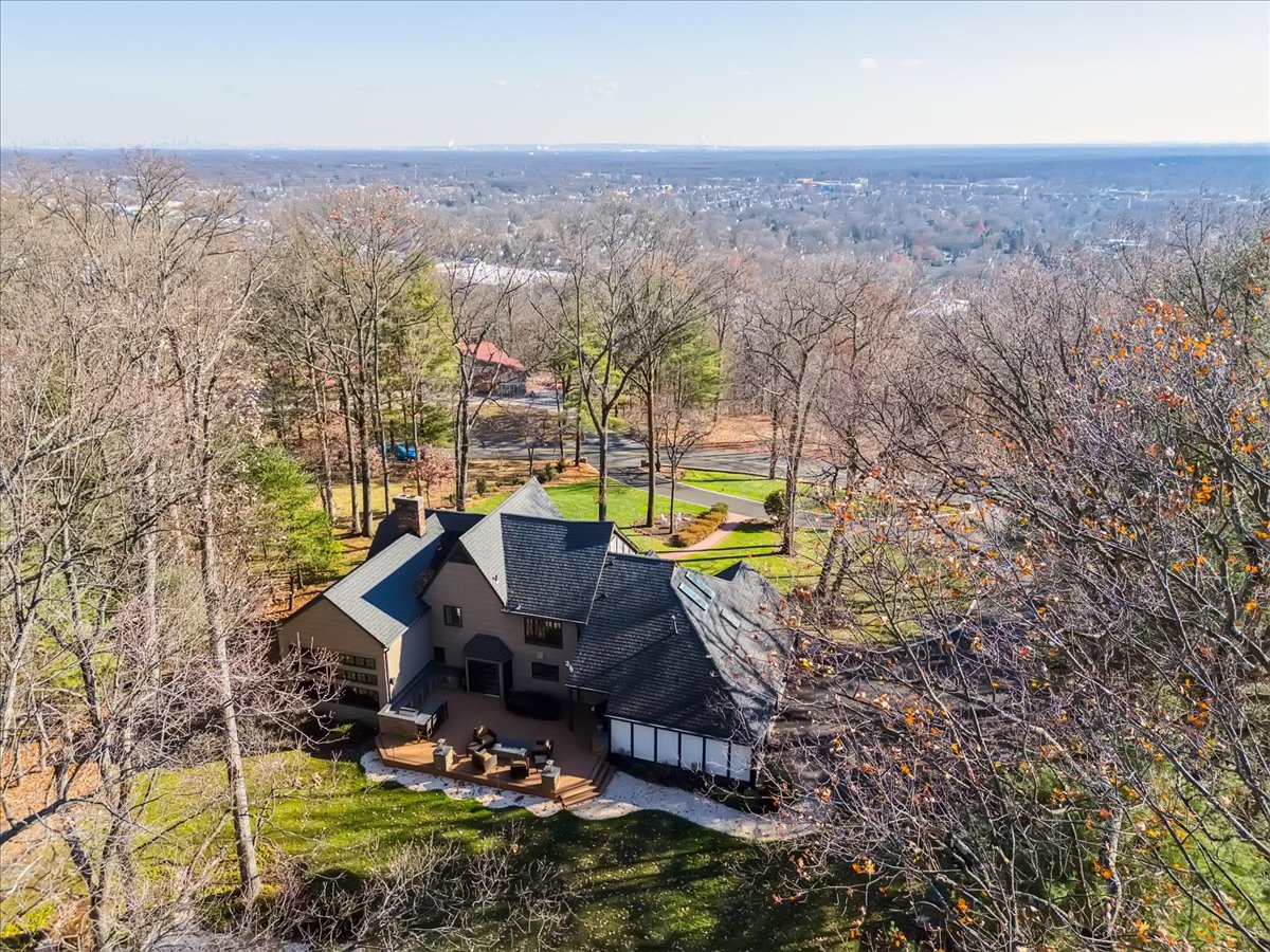 Johnston Drive Watchung, NJ 07069 - Photo 9 of 85 an aerial view of a house with a yard and lake view