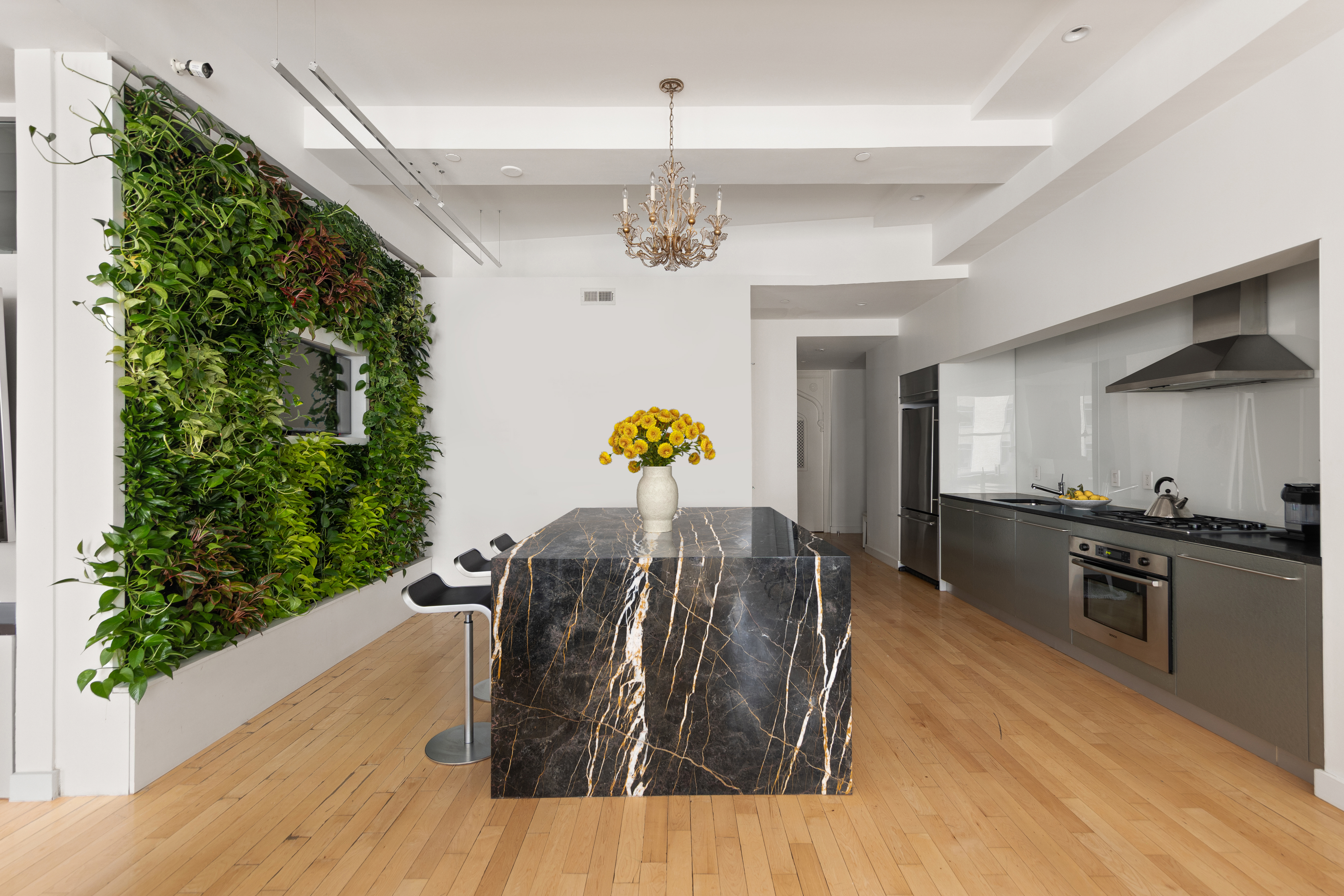15 Broad Street, Unit 1006 Manhattan, NY 10005 - Photo 6 of 32 a living room with furniture and a chandelier