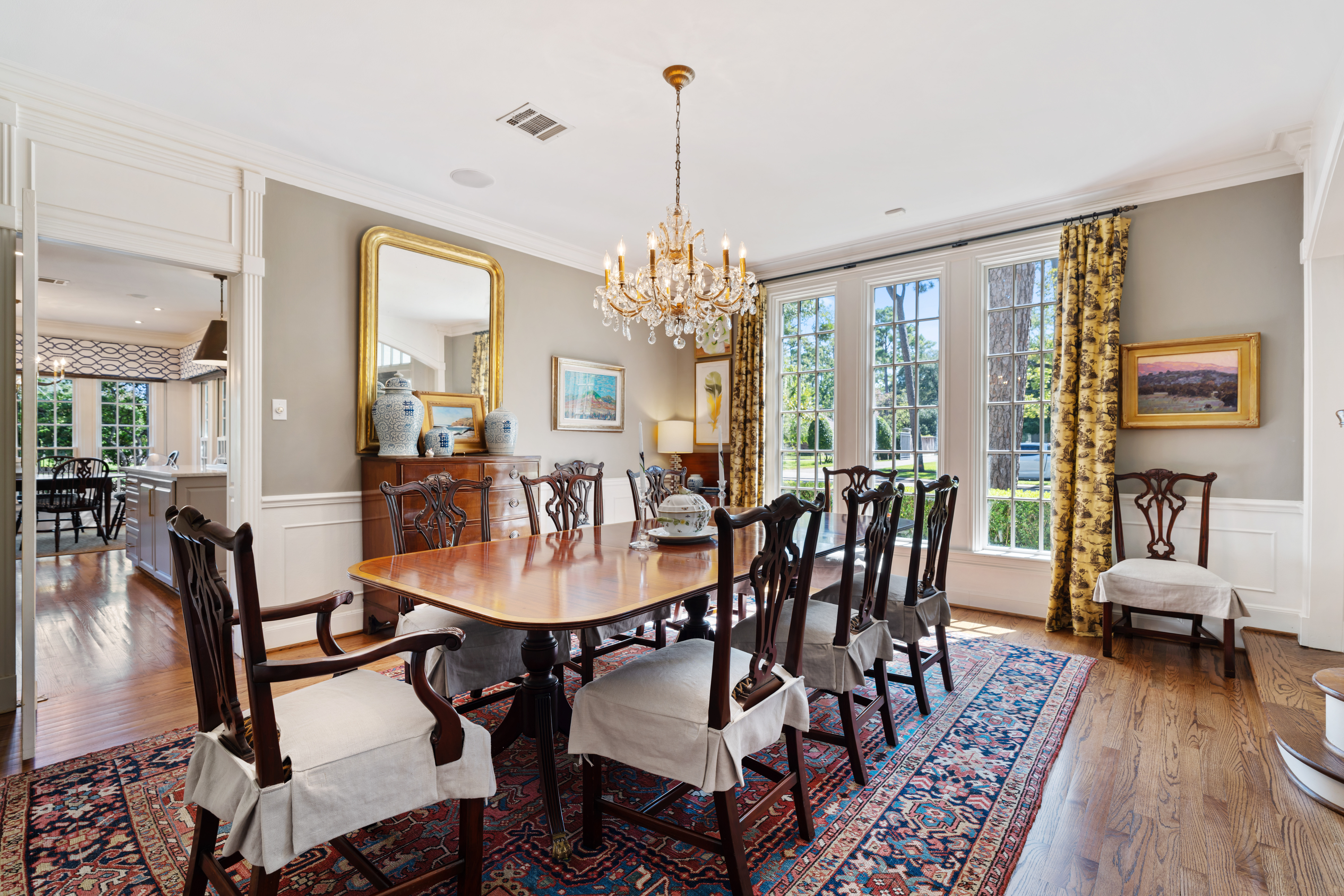 711 Pifer Road Houston, TX 77024 - Photo 10 of 53 a dining room with furniture a chandelier and wooden floor