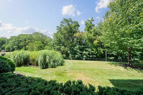 a view of a garden with a house