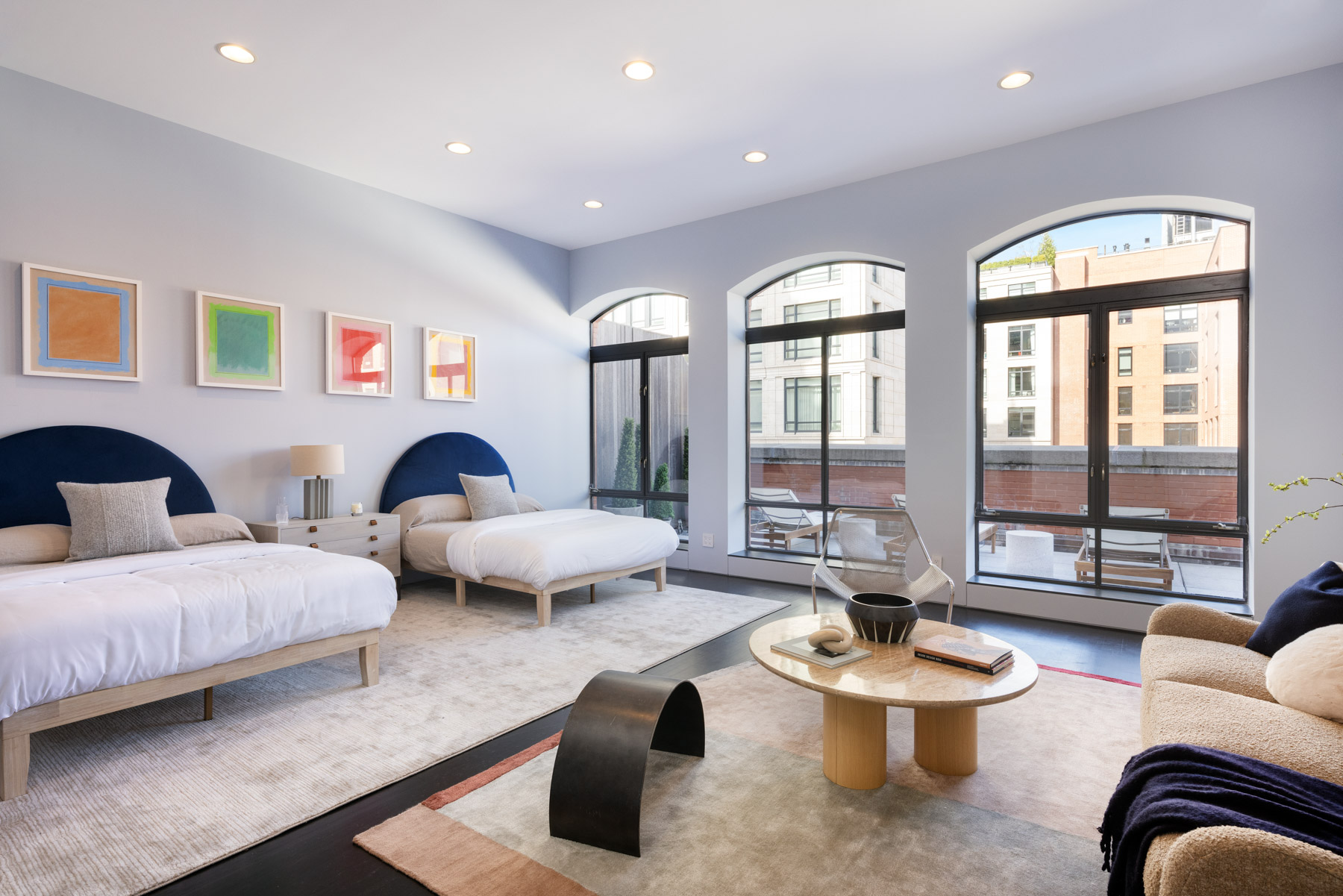 92 Laight Street, Unit PHC Manhattan, NY 10013 - Photo 9 of 16 a living room with furniture and a large window