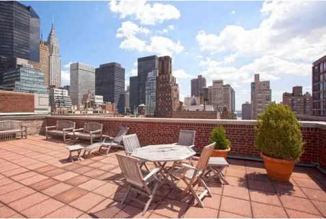 a view of a terrace with furniture