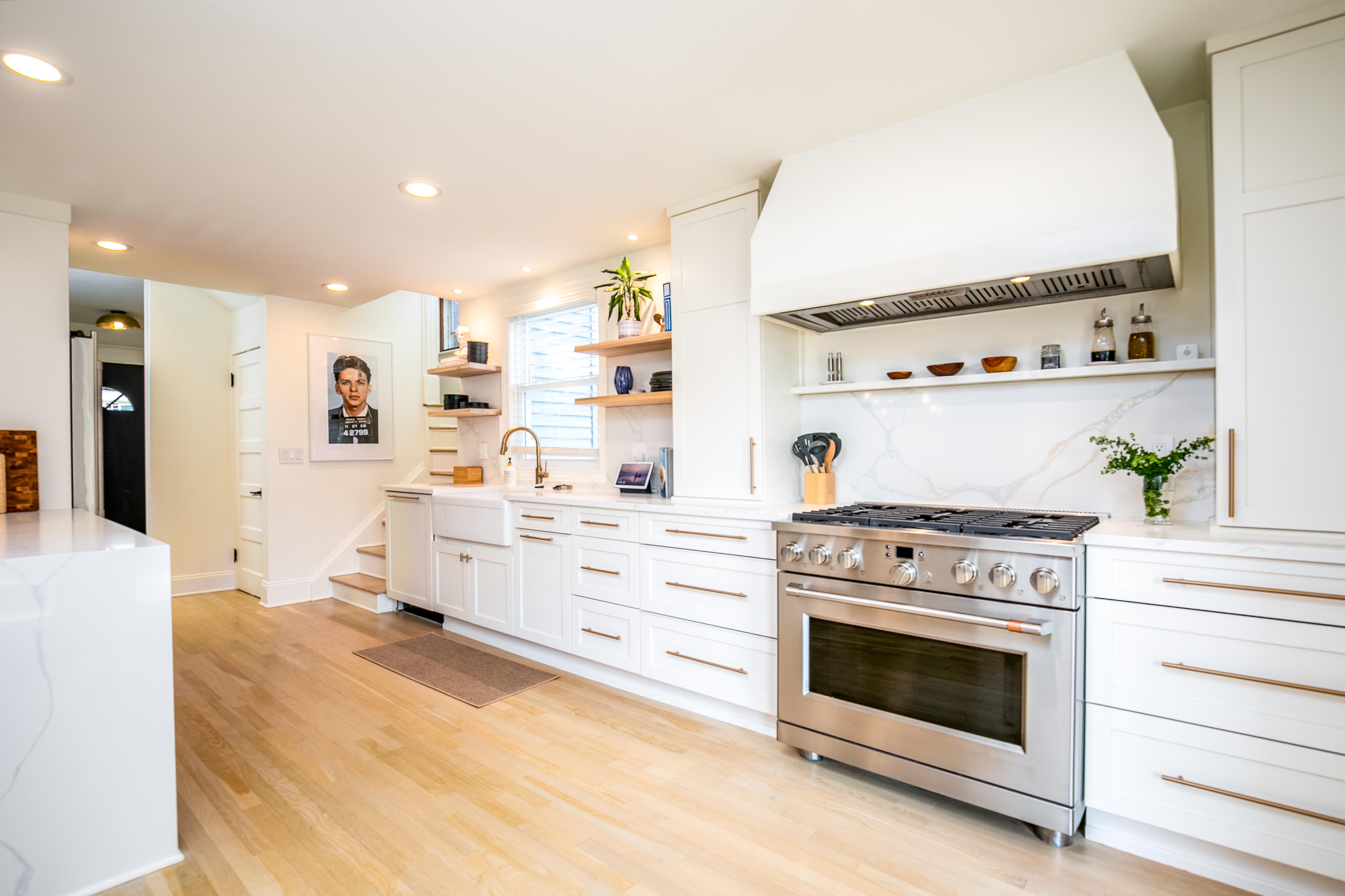 163 Ridge Road Rutherford, NJ 07070 - Photo 18 of 59 a kitchen with stove top oven and cabinets