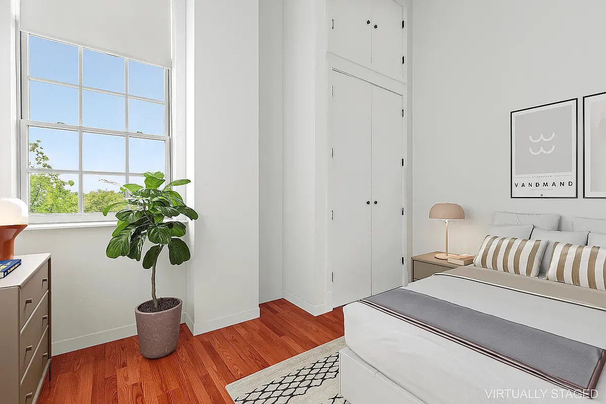 180 Bainbridge Street, Unit 401 Brooklyn, NY 11233 - Photo 5 of 23 a bedroom with a bed and a plant