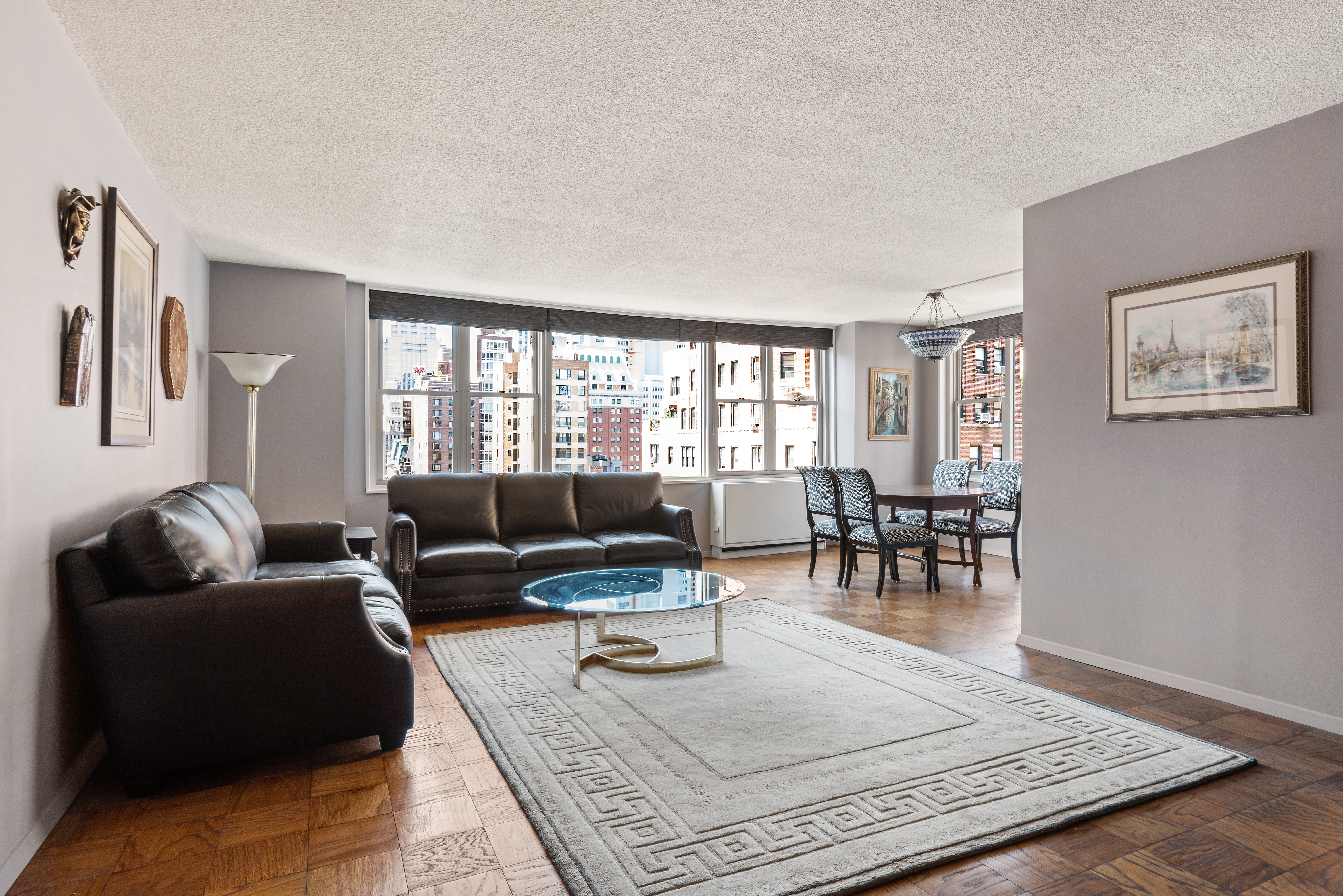 137 East 36th Street, Unit 12G Manhattan, NY 10016 - Photo 2 of 15 a living room with furniture and a couch
