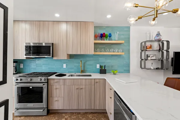 a kitchen with a stove and a microwave