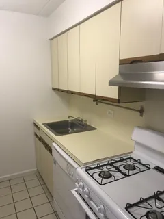 a kitchen with a stove and a microwave