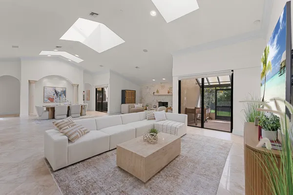 a dining hall with granite countertop a sink and a stove