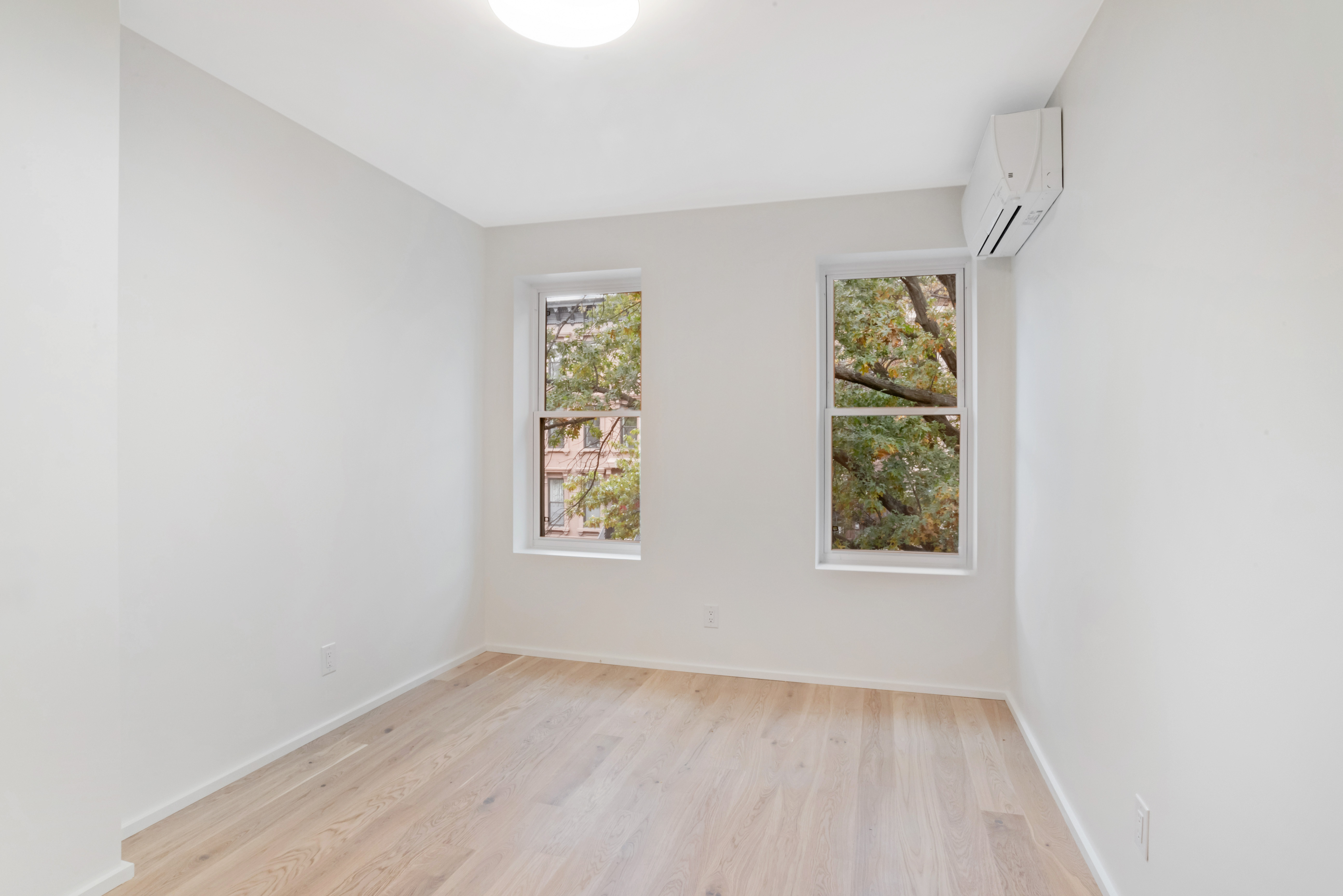 42 Monroe Street, Unit 2 Brooklyn, NY 11238 - Photo 8 of 19 an empty room with a window