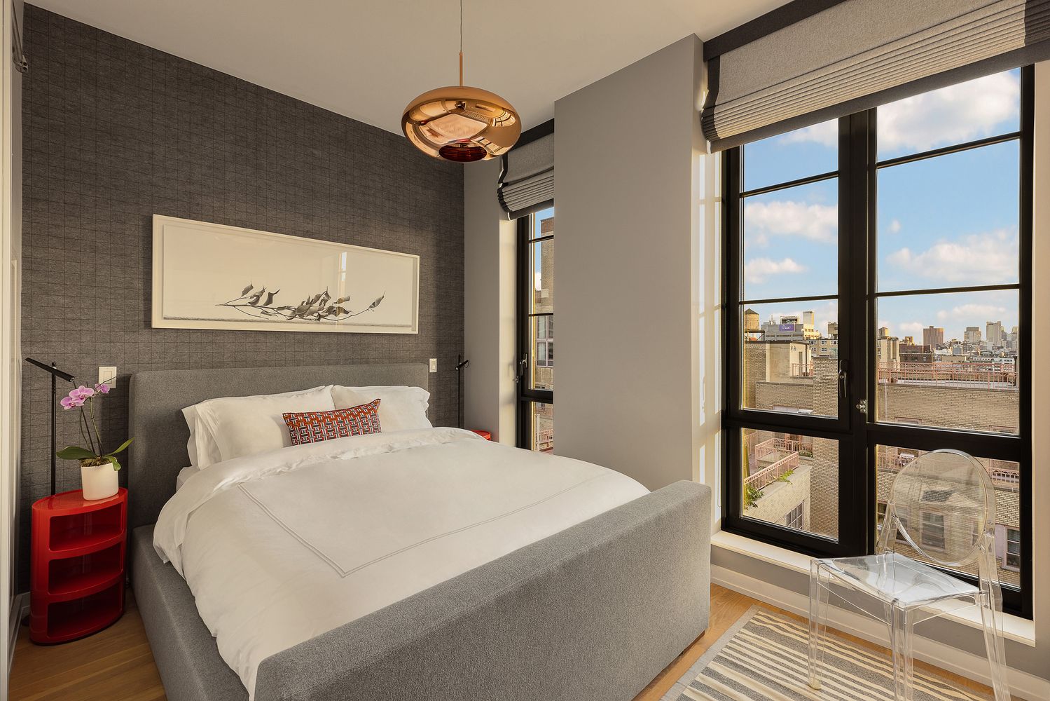 a bedroom with a large bed and a window