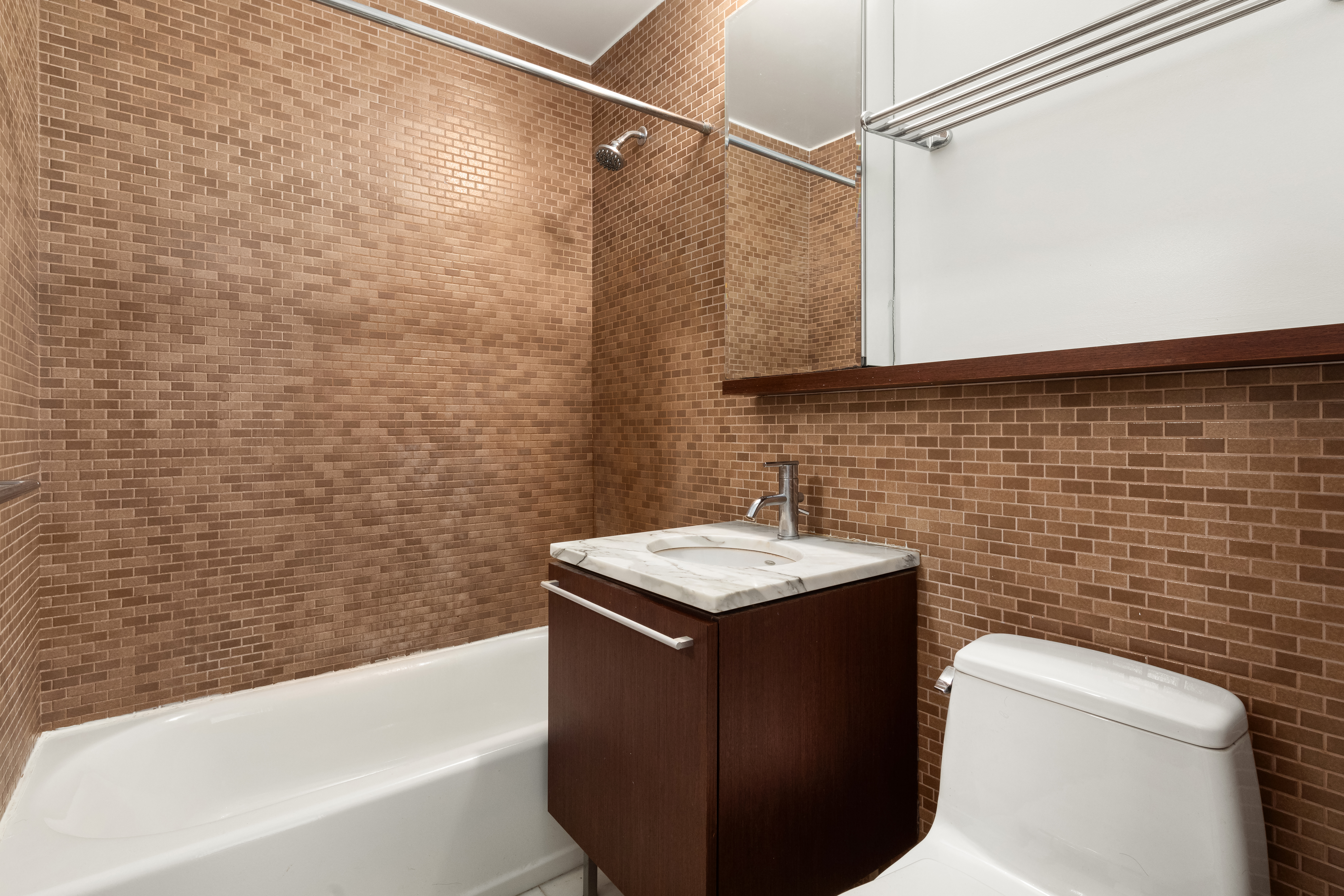 100 West 93rd Street, Unit 5K Manhattan, NY 10025 - Photo 5 of 12 a bathroom with a sink toilet and shower