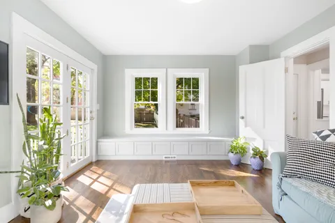 a front view of a house with outdoor seating