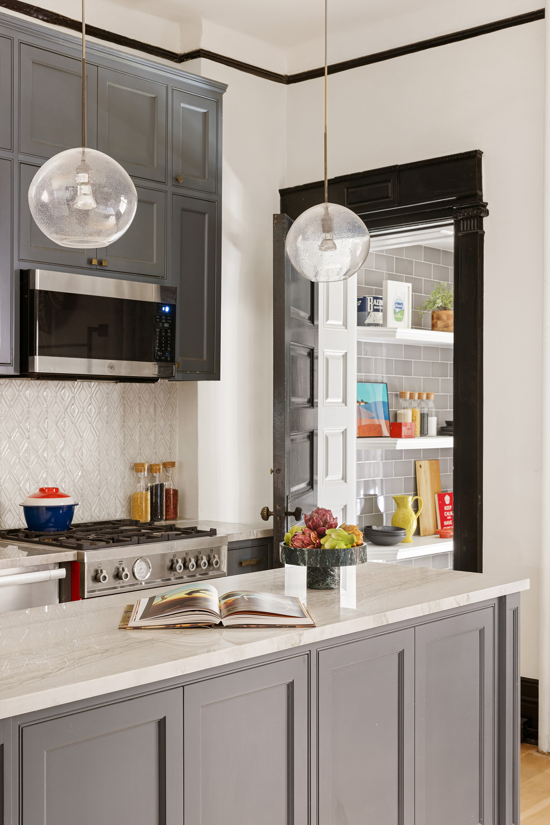 614 West 146th Street, Unit 4FAM Manhattan, NY 10031 - Photo 9 of 18 a kitchen with stainless steel appliances a microwave a stove and white cabinets
