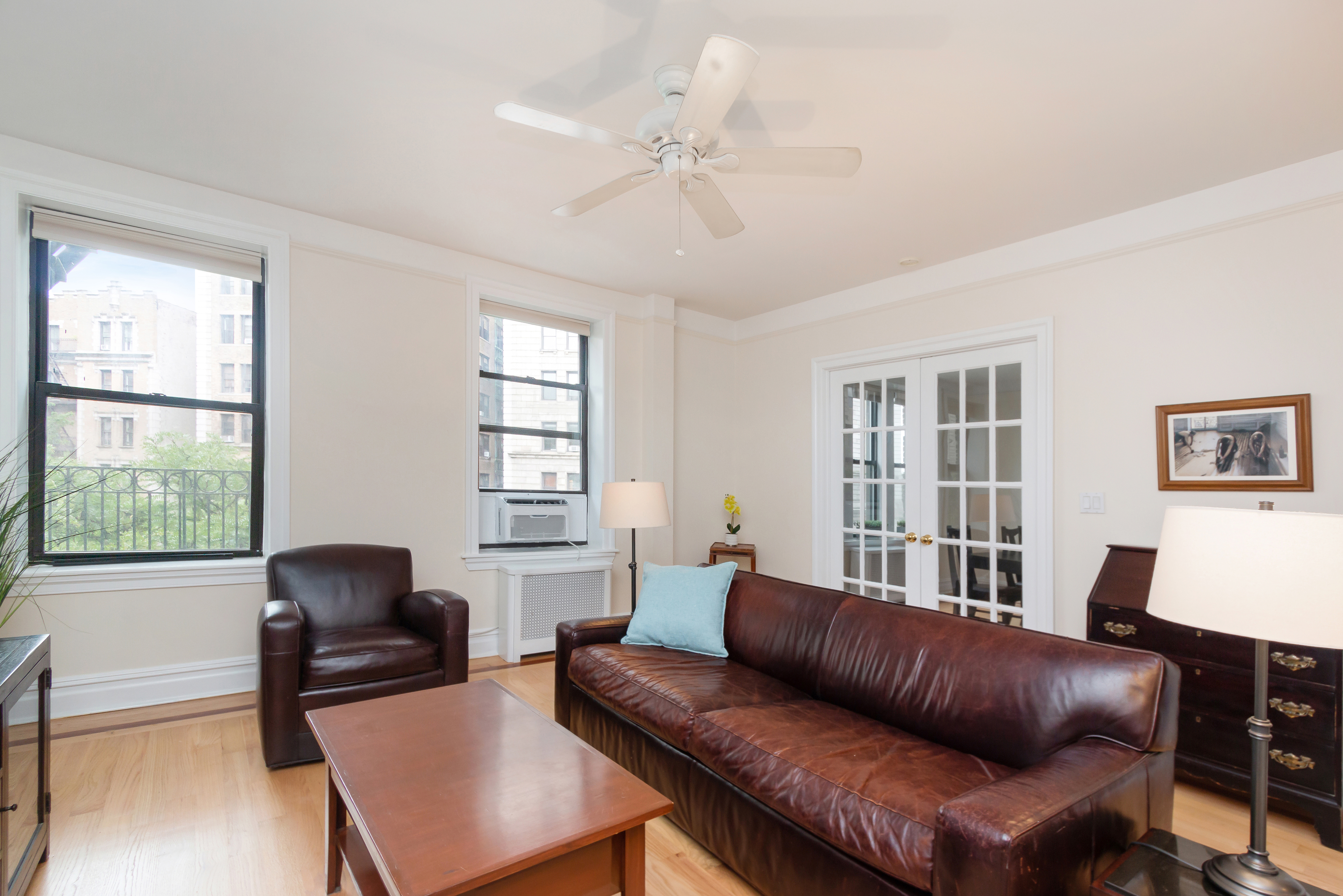 801 Riverside Drive, Unit 4F Manhattan, NY 10032 - Photo 4 of 13 a living room with furniture and a window
