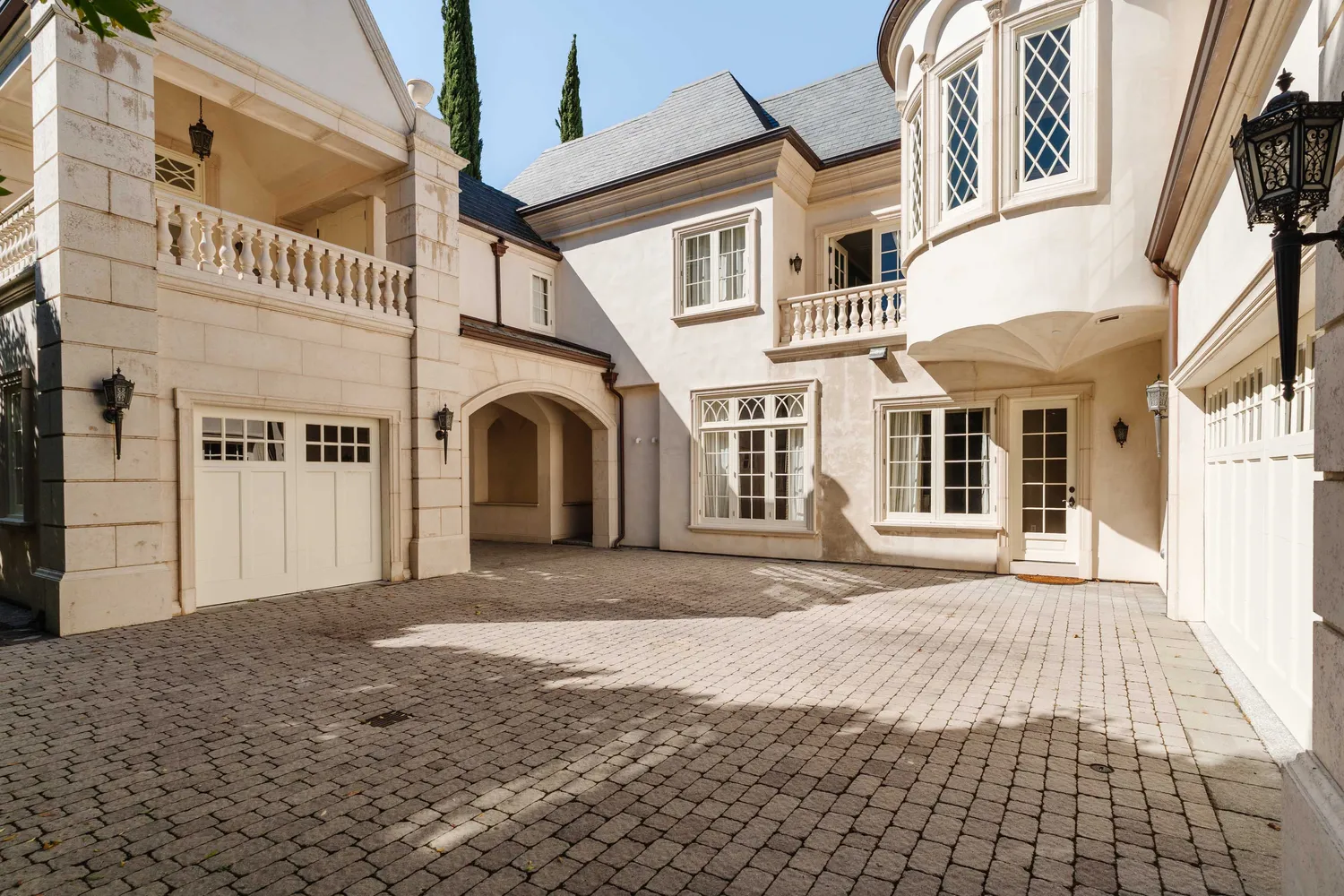 a front view of a building with a yard