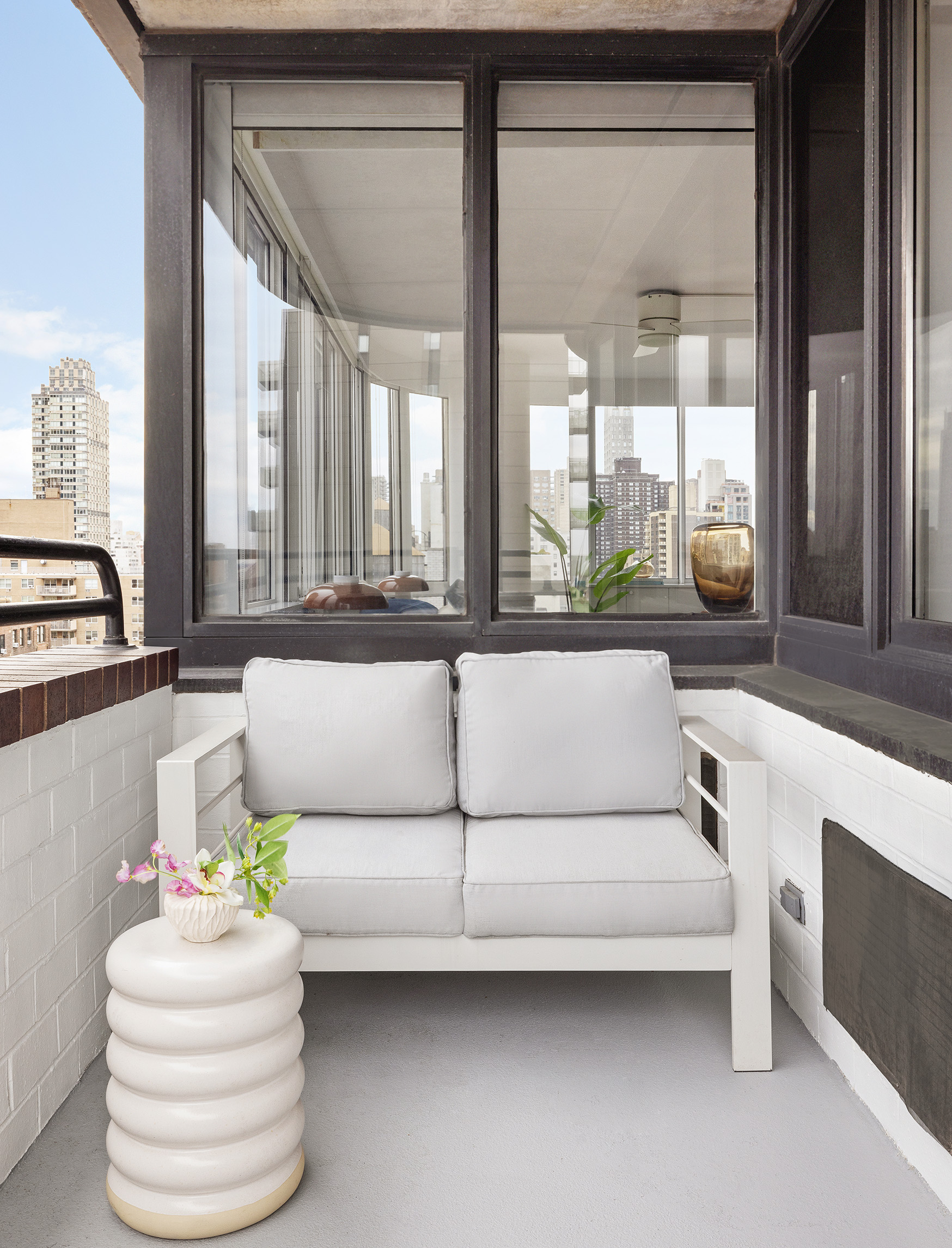 455 East 86th Street, Unit 20E Manhattan, NY 10028 - Photo 13 of 14 a living room with furniture and a large window