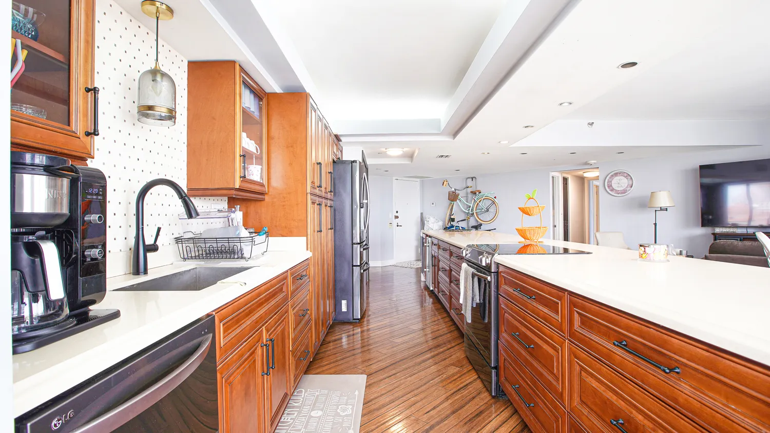 a kitchen with a sink and a stove top oven