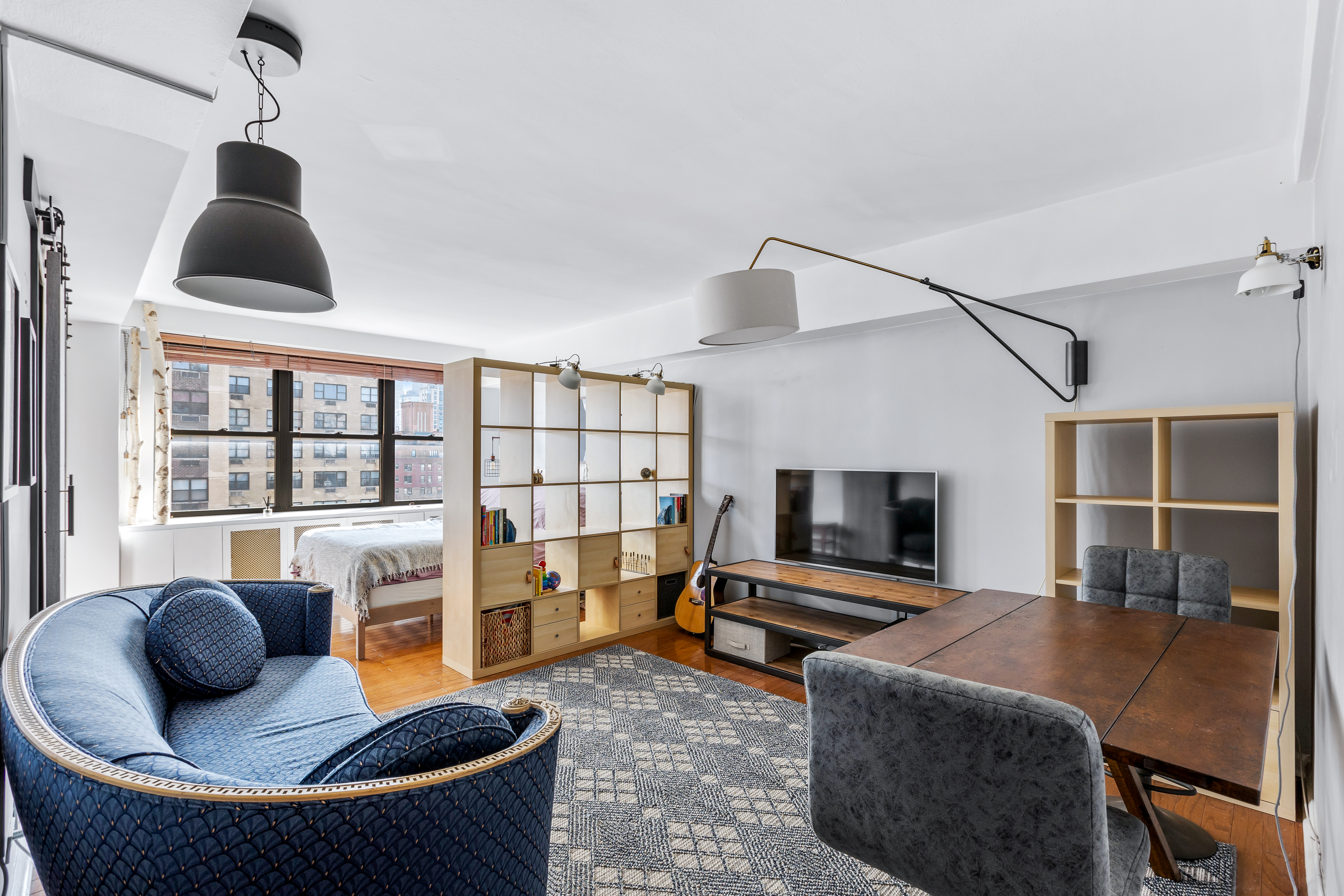 345 East 81st Street, Unit 19A Manhattan, NY 10028 - Photo 5 of 22 a living room with furniture and a flat screen tv
