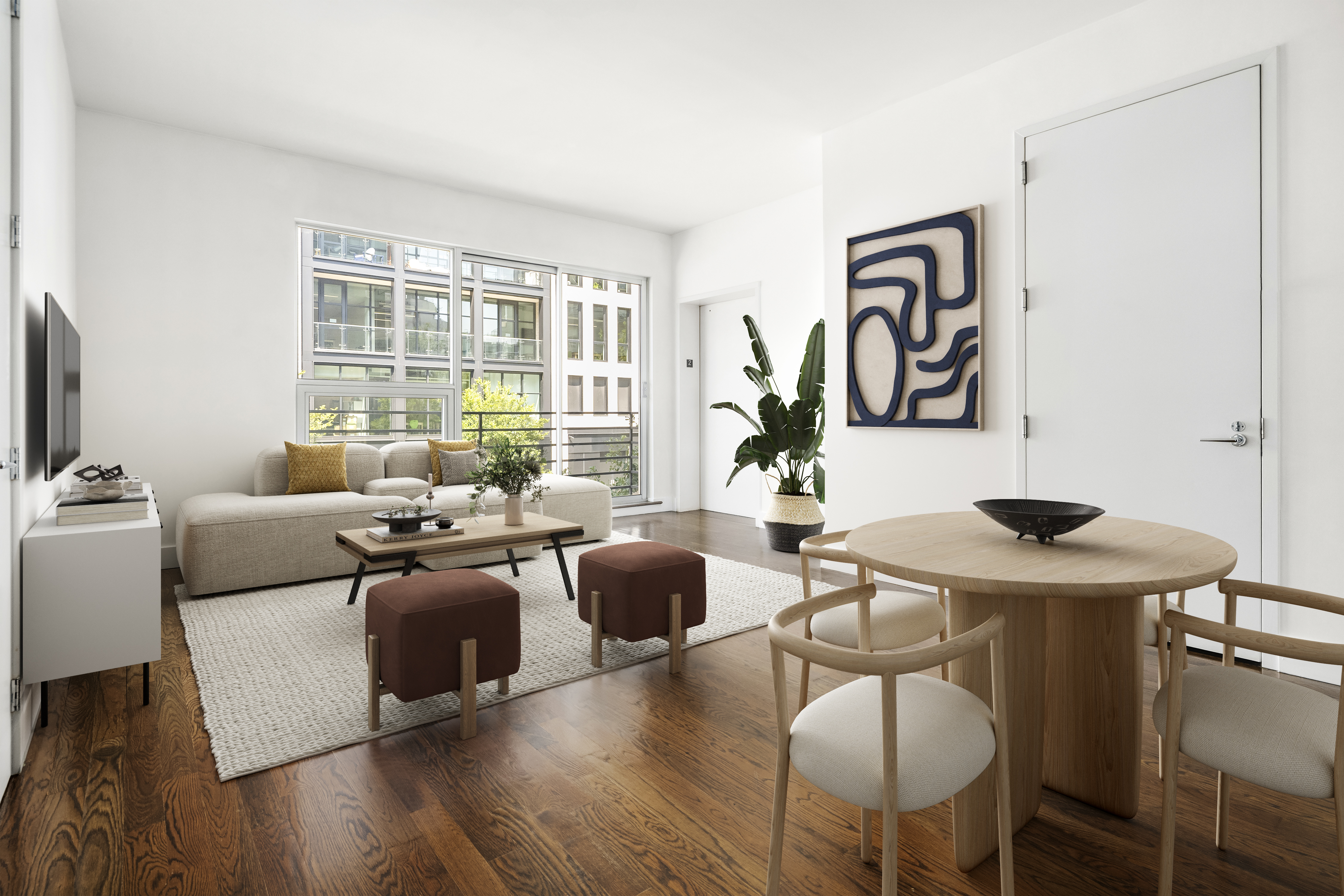 a living room with furniture a wooden floor and a large window