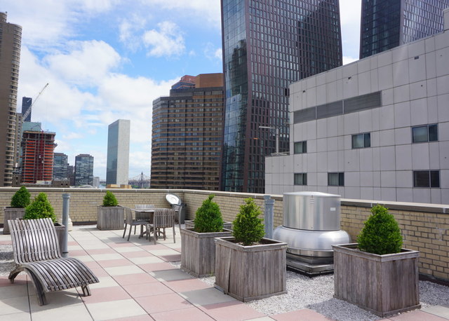 333 East 34th Street, Unit 10H Manhattan, NY 10016 - Photo 14 of 16 a view of a patio with plants and chairs