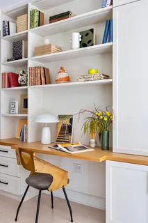a spacious bedroom with a bed and a large window