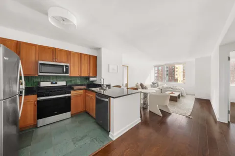 a kitchen with a sink stove and refrigerator