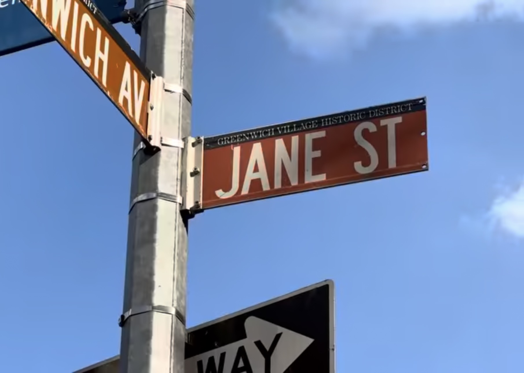 31 Jane Street, Unit 2CD Manhattan, NY 10014 - Photo 18 of 20 a street sign on a wall next to a blue wall