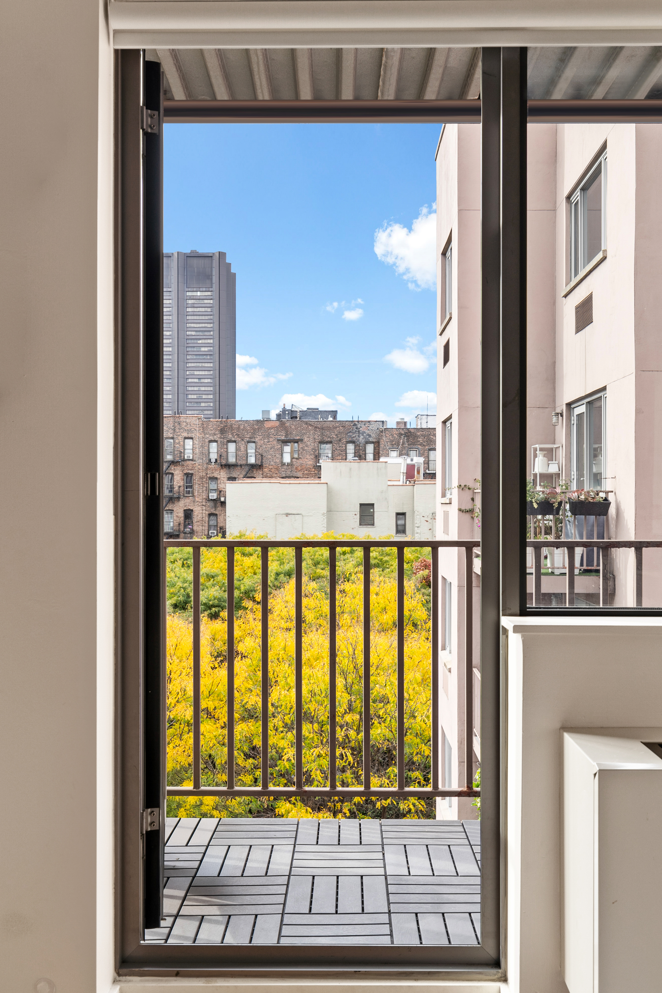 1810 3rd Avenue, Unit A9B Manhattan, NY 10029 - Photo 8 of 16 a view of a city from a living room