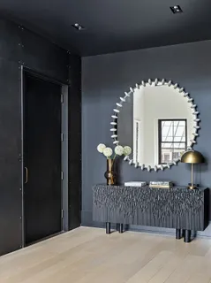 a bedroom with a bed and a lamp