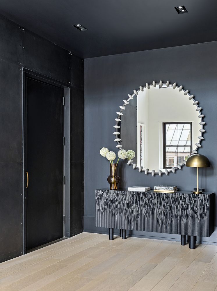 a bedroom with a bed and a lamp