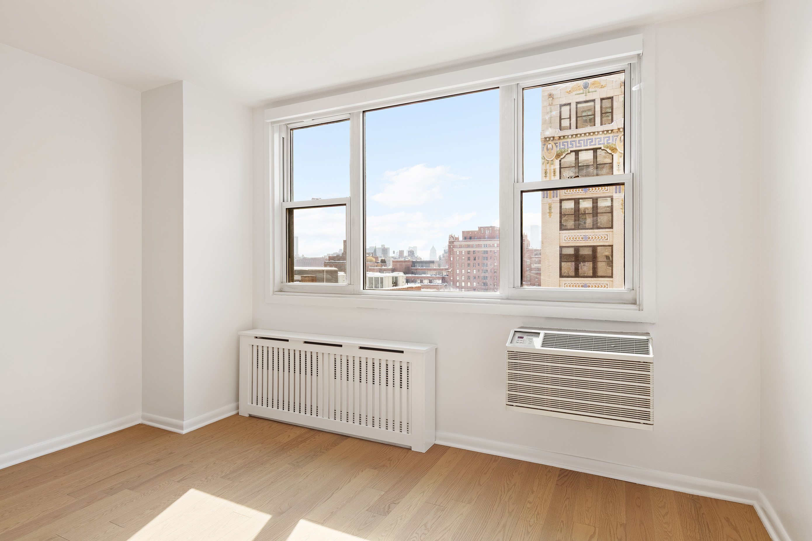 77 7th Avenue, Unit 12P Manhattan, NY 10011 - Photo 4 of 15 a view of a room with a large window