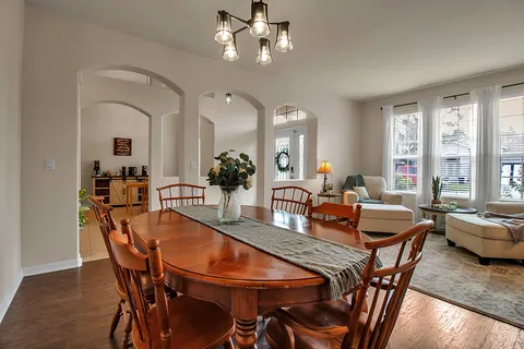 a kitchen with kitchen island granite countertop a stove and a sink