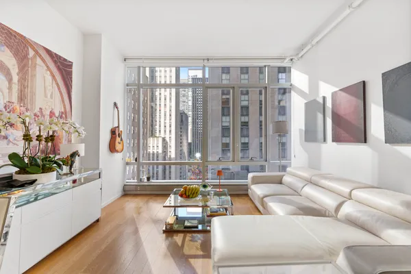 a living room with furniture and a large window