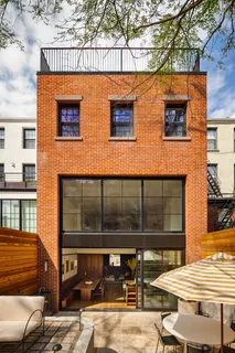 a front view of a house with a large window
