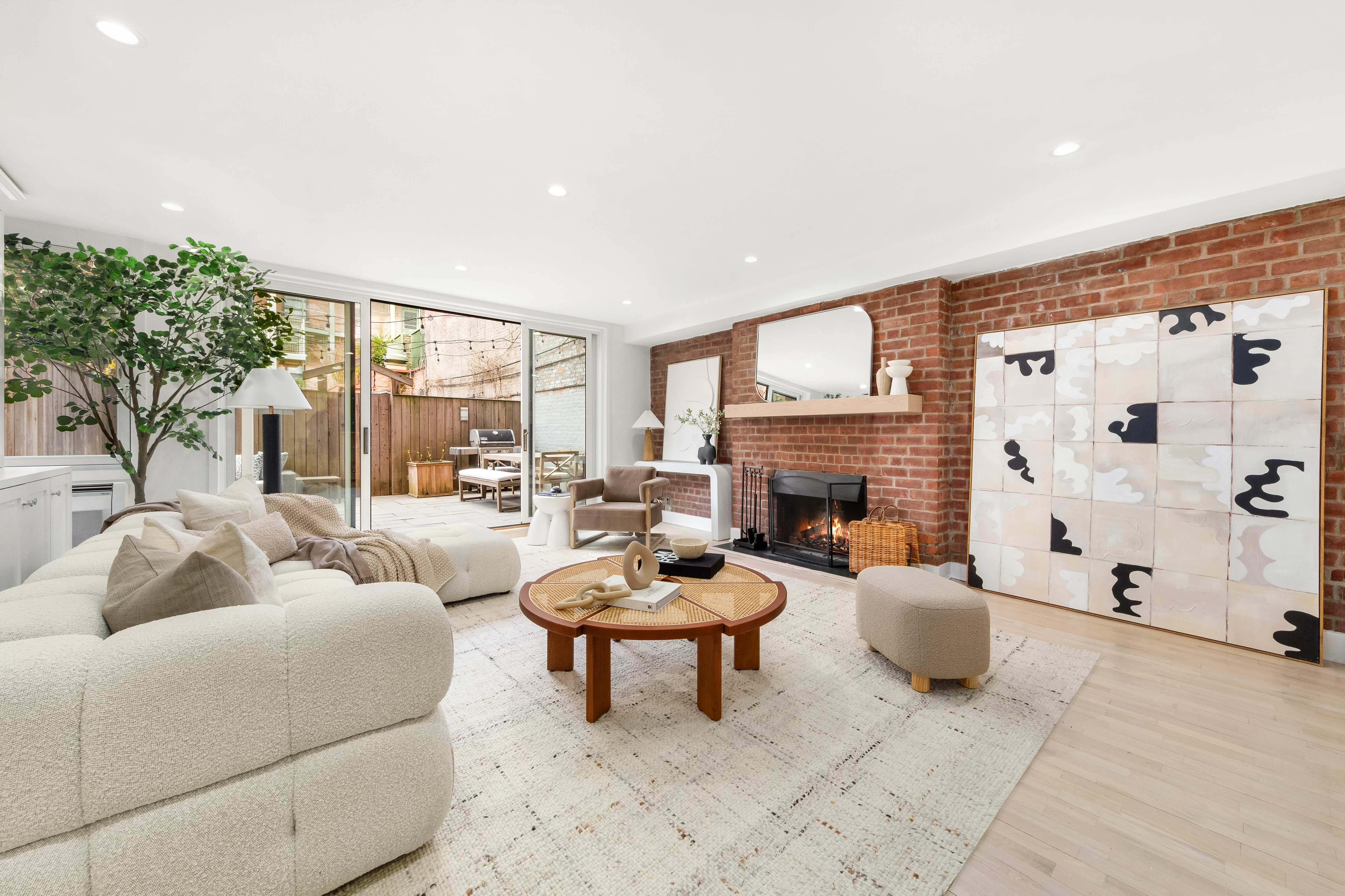 31 West 93rd Street, Unit 1D Manhattan, NY 10025 - Photo 6 of 18 a living room with furniture a fireplace and a large window