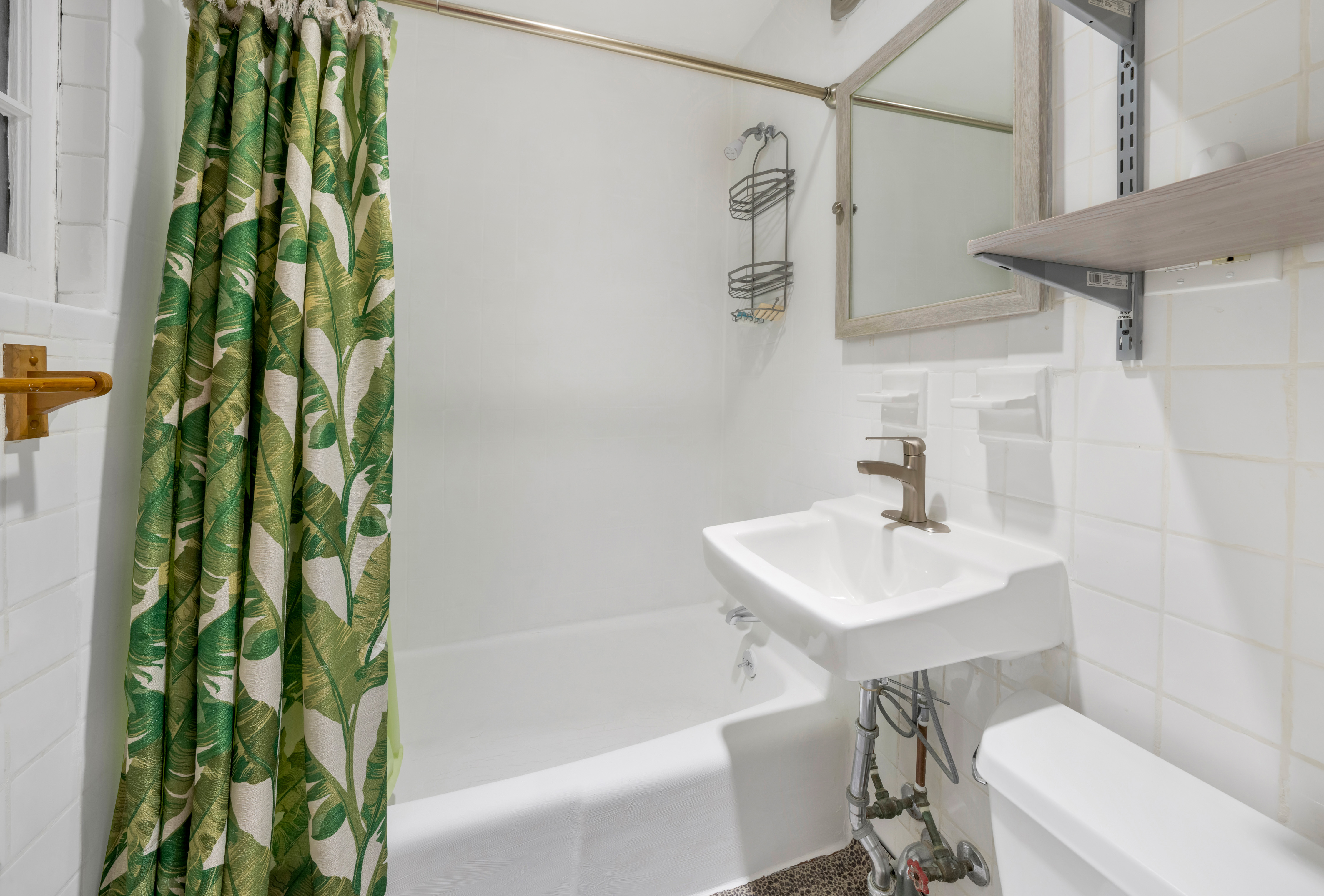 150 East 83rd Street, Unit 4D Manhattan, NY 10028 - Photo 1 of 1 a bathroom with a sink a toilet and shower