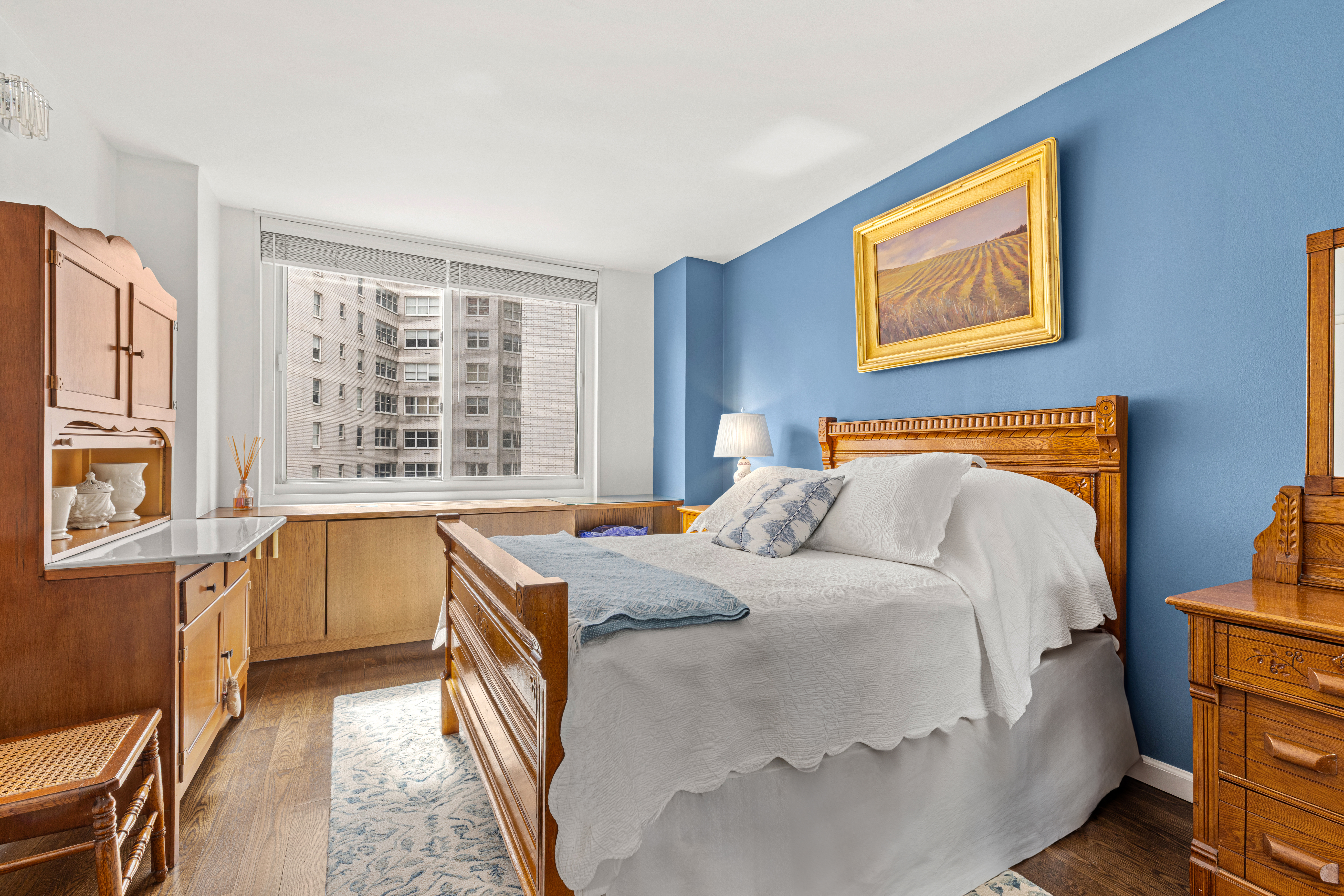 2025 Broadway, Unit 5K Manhattan, NY 10023 - Photo 3 of 15 a bedroom with a bed and a large window