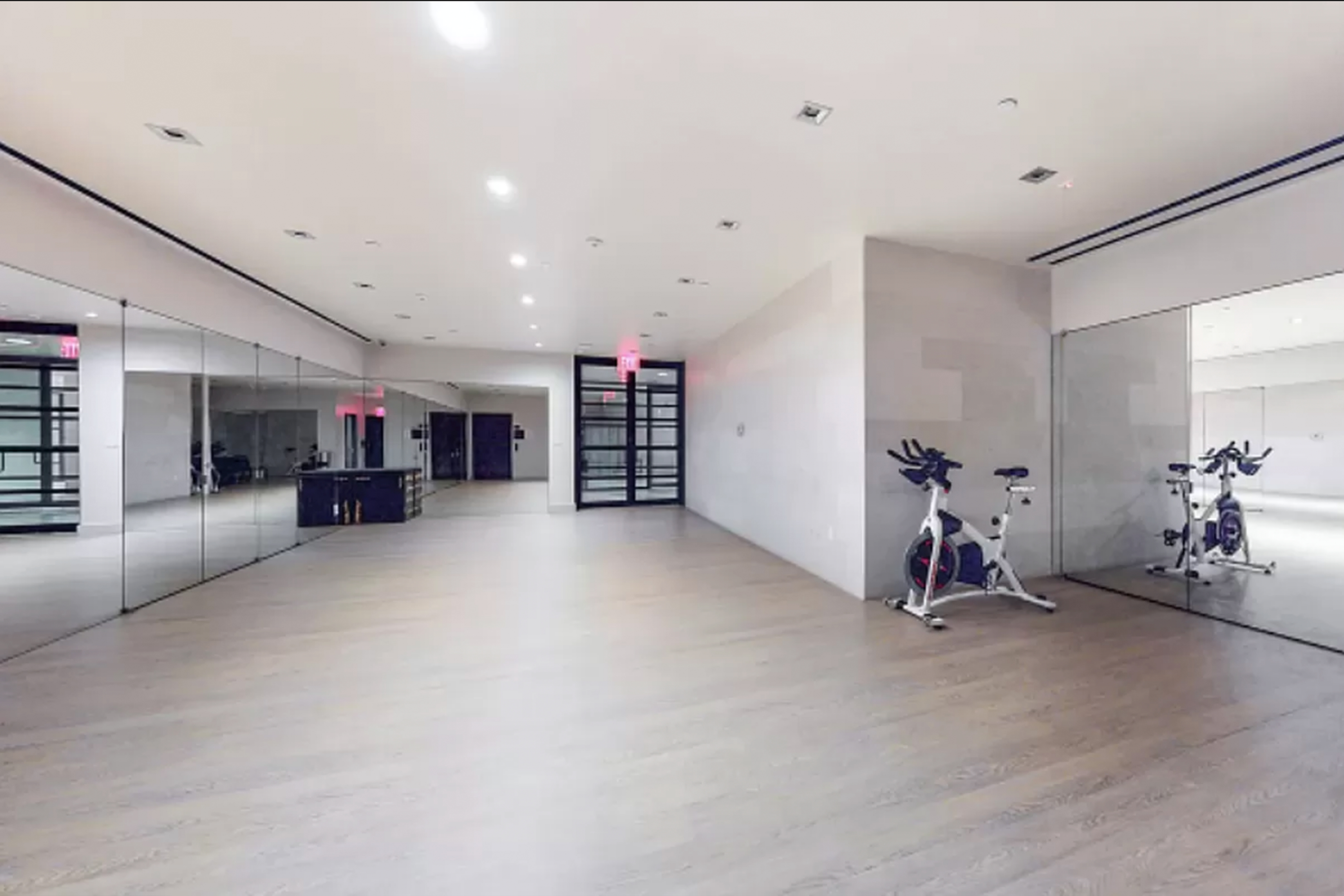 20 Pine Street, Unit 2012 Manhattan, NY 10005 - Photo 18 of 25 a view of a room with gym equipment