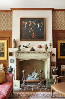 a living room with a large window and a rug