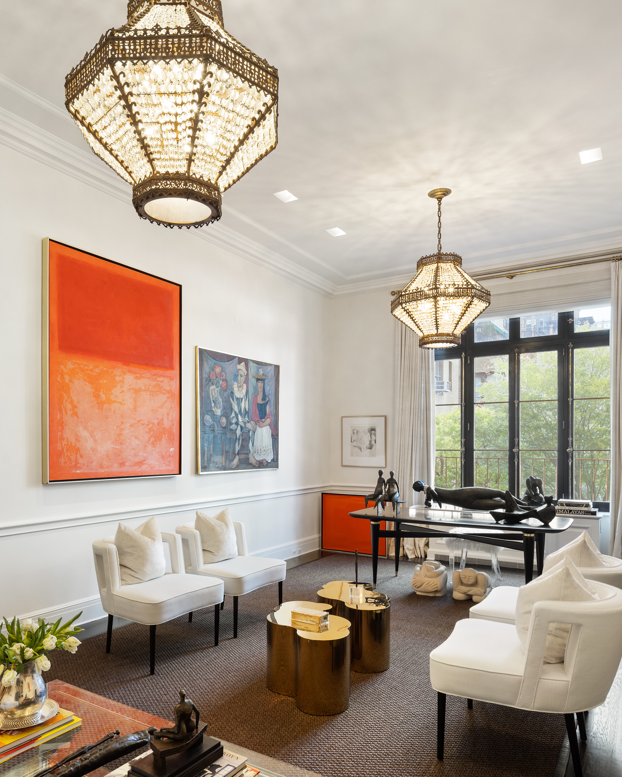 170 East 78th Street, Unit 8E Manhattan, NY 10075 - Photo 2 of 16 a living room with furniture a chandelier and a large window