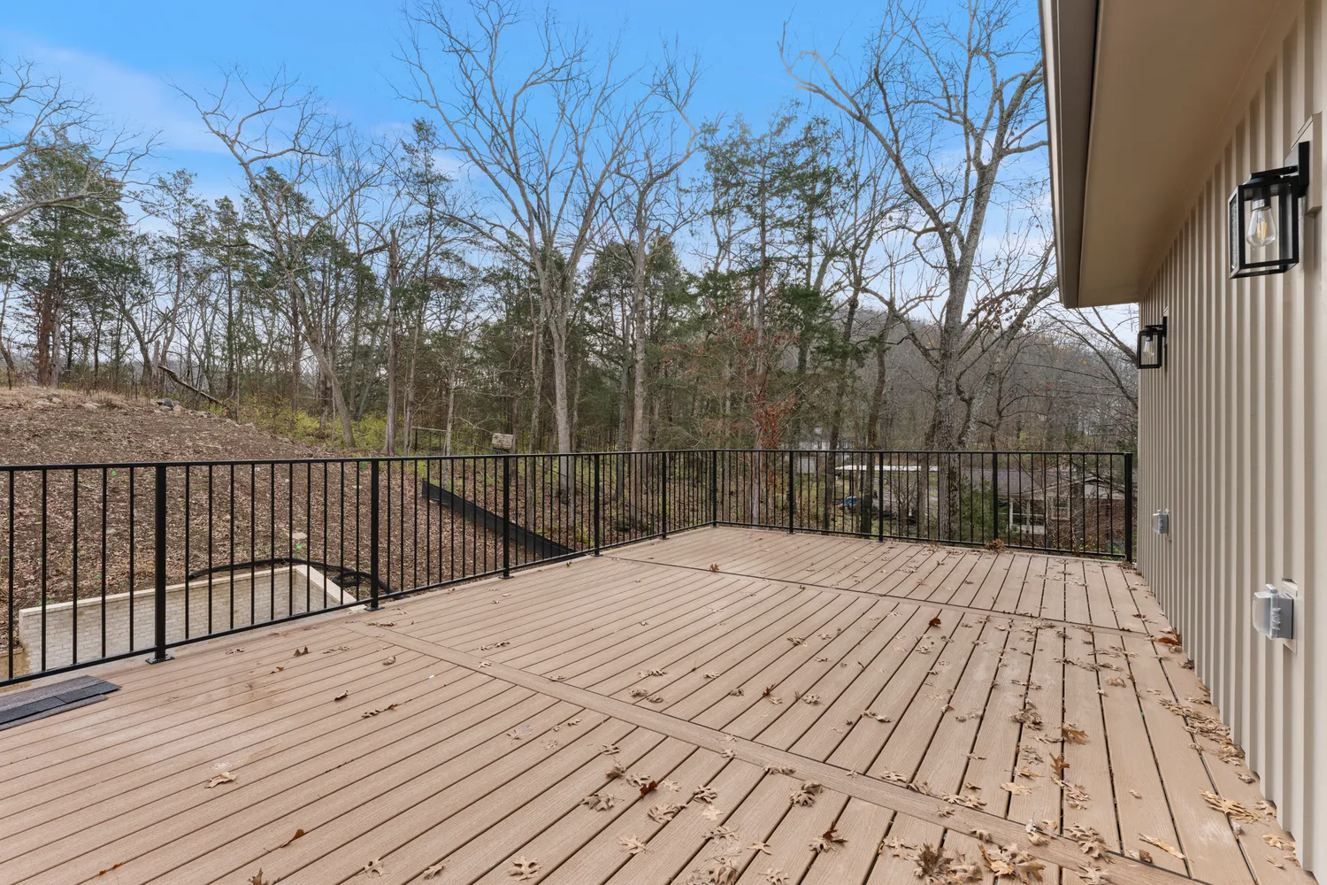 a view of a backyard with large trees