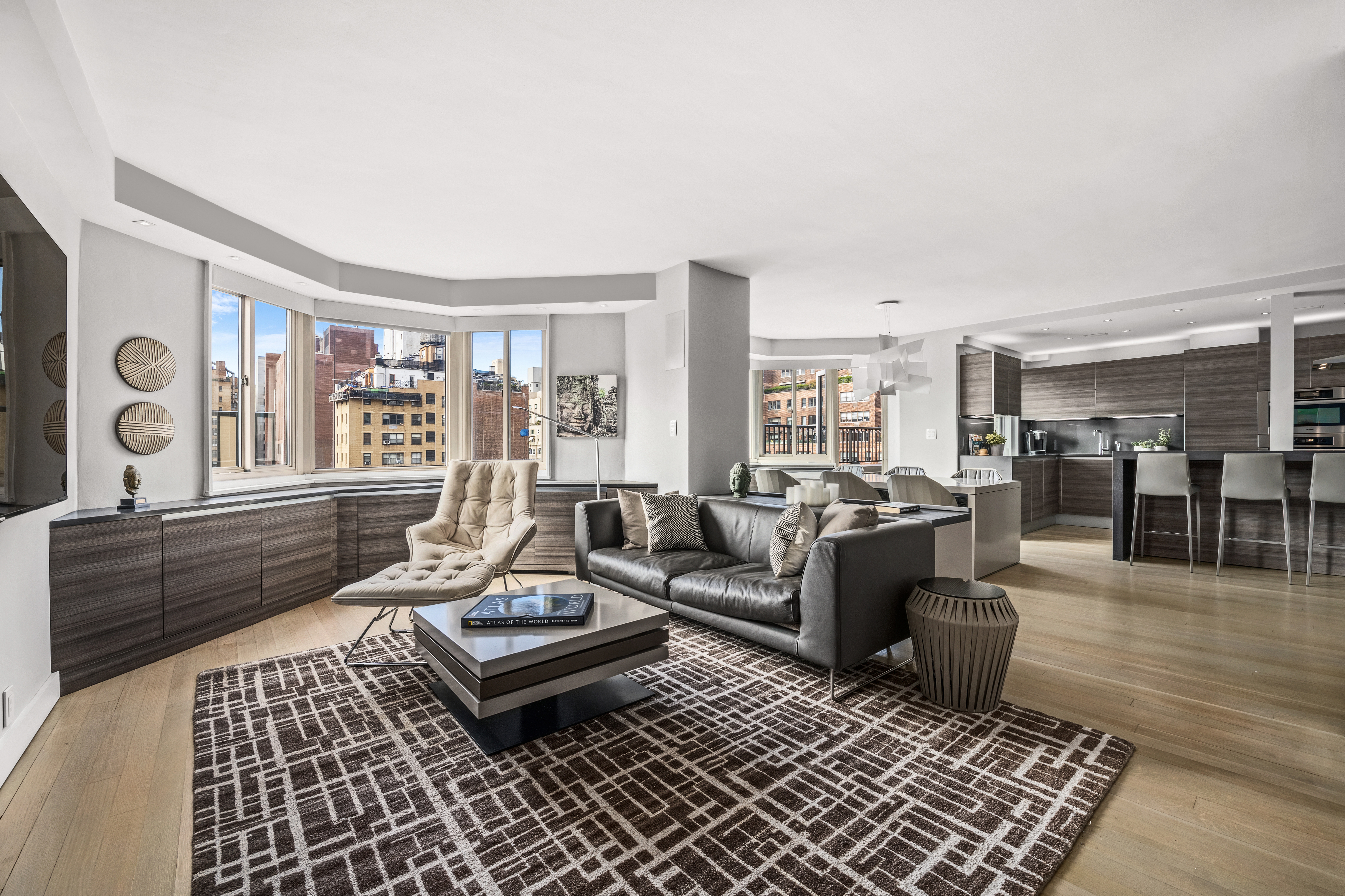 301 East 78th Street, Unit 16EF Manhattan, NY 10075 - Photo 4 of 12 a living room with furniture and a table