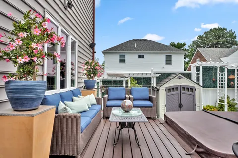 a view of balcony with outdoor seating and wooden floor