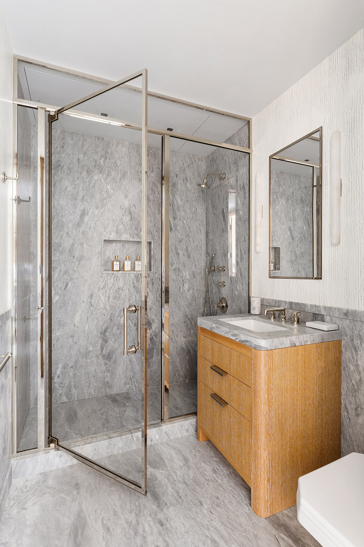25 Bond Street, Unit PHW Manhattan, NY 10012 - Photo 20 of 34 a bathroom with a granite countertop bathtub shower sink mirror and toilet