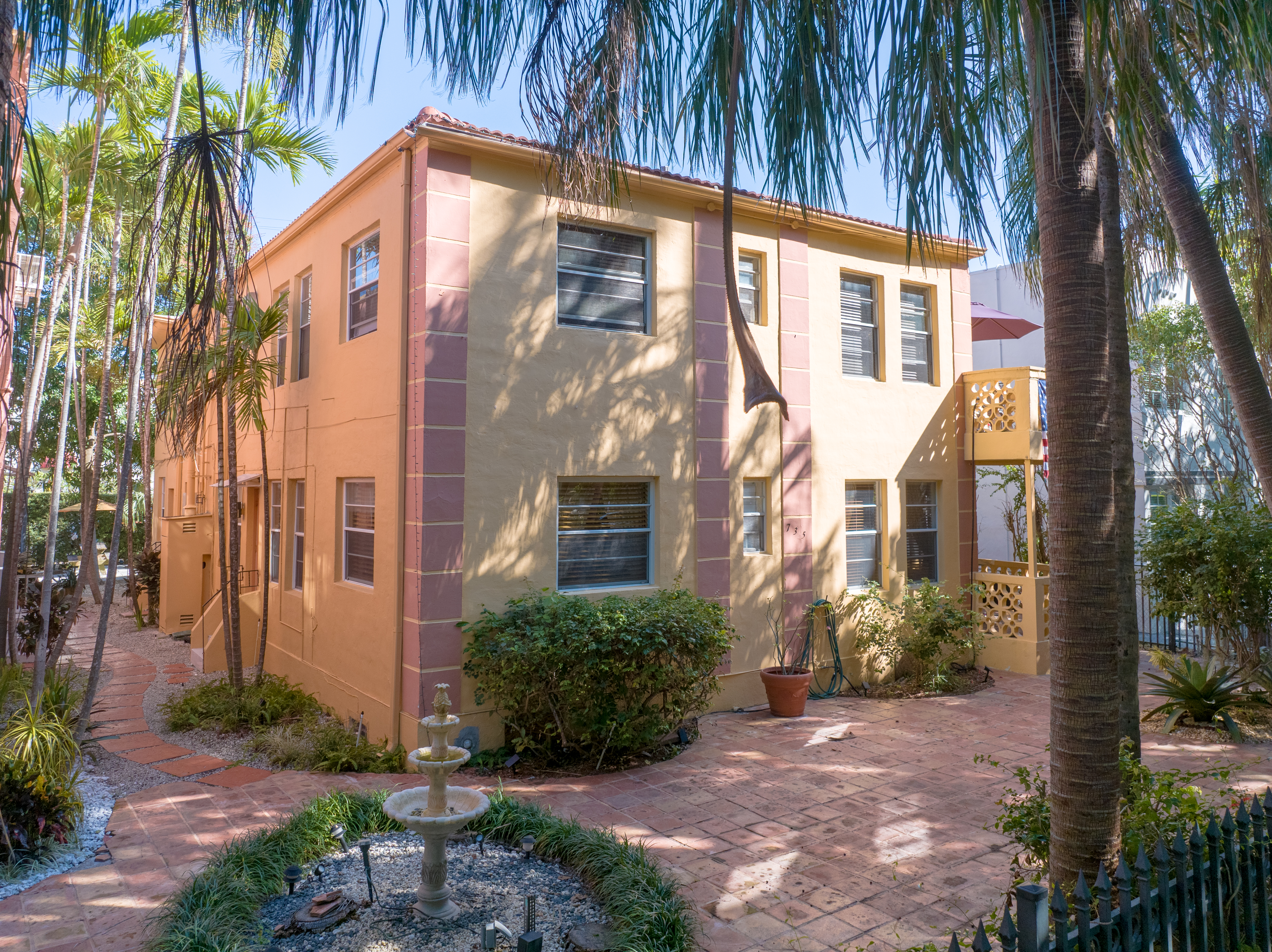 735-745 Meridian Avenue Miami Beach, FL 33139 - Photo 2 of 62 a view of a large building with a tree