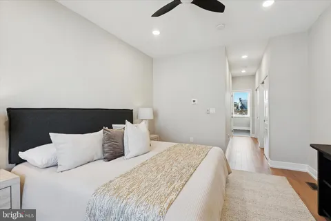 a bedroom with bed and window