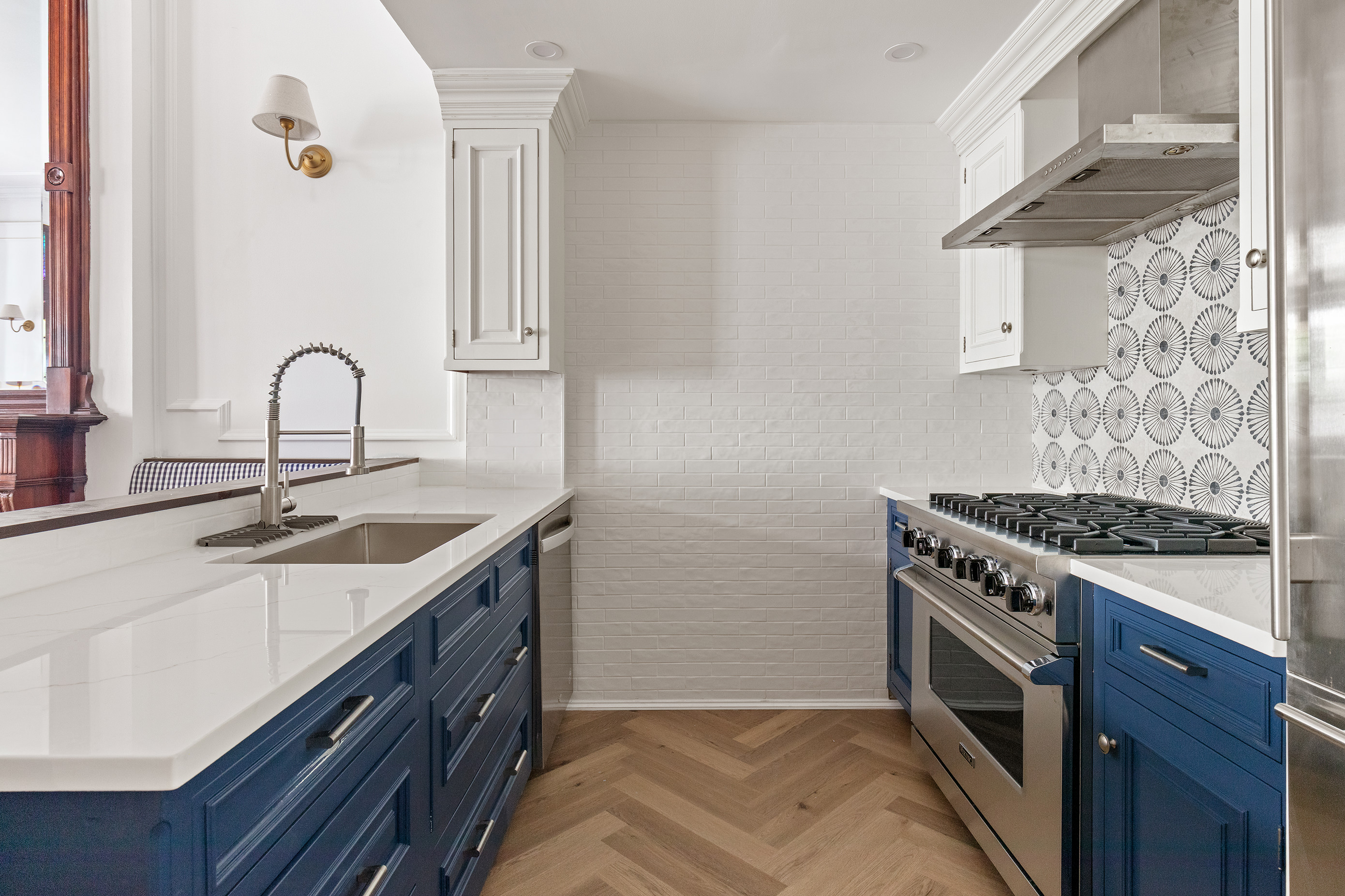 129 East 61st Street, Unit 3 Manhattan, NY 10065 - Photo 4 of 13 a kitchen with stainless steel appliances granite countertop a sink stove and cabinets