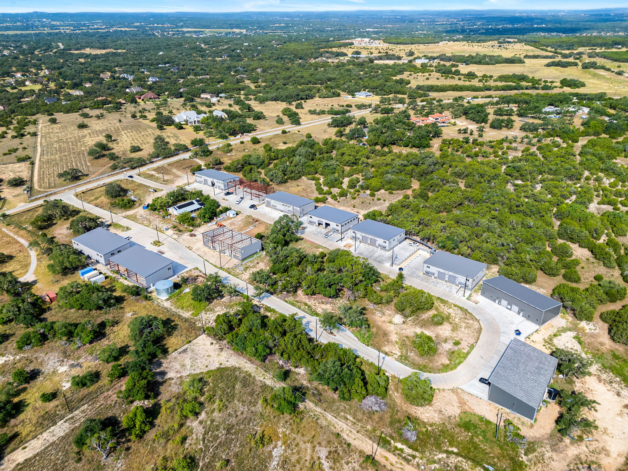 10020 Darden Hill Road, Unit 401 Austin, TX 78737 - Photo 48 of 50 an aerial view of residential houses with outdoor space