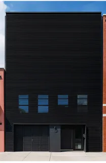 a black and white building with a small space